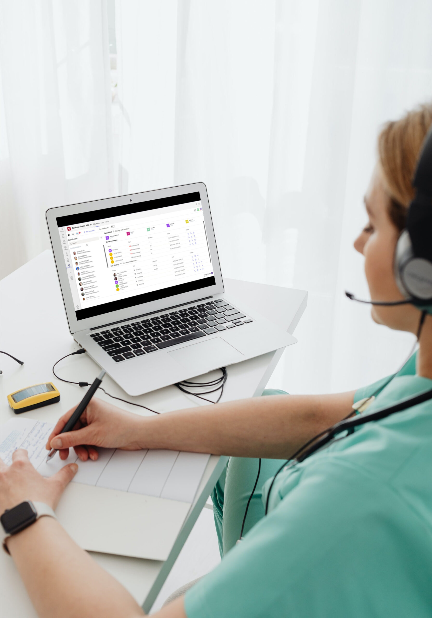 Call with the connector Rainbow Telephony for Microsoft Teams Woman with a headset taking notes aside from using the connector Rainbow Telephony for Microsoft Teams