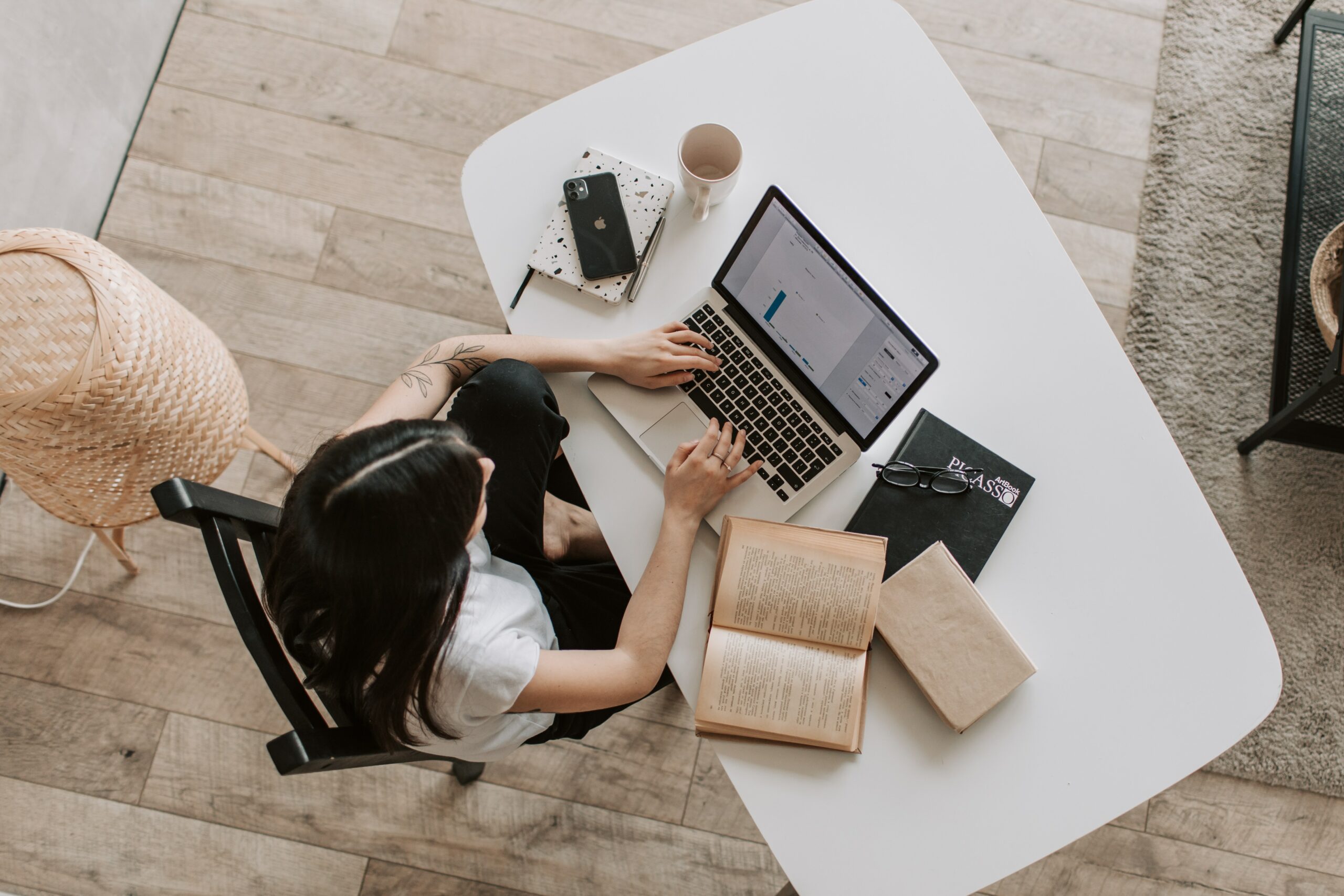 Remote learning is flexible Young woman with black hair sitting in front of a laptop learning remotely